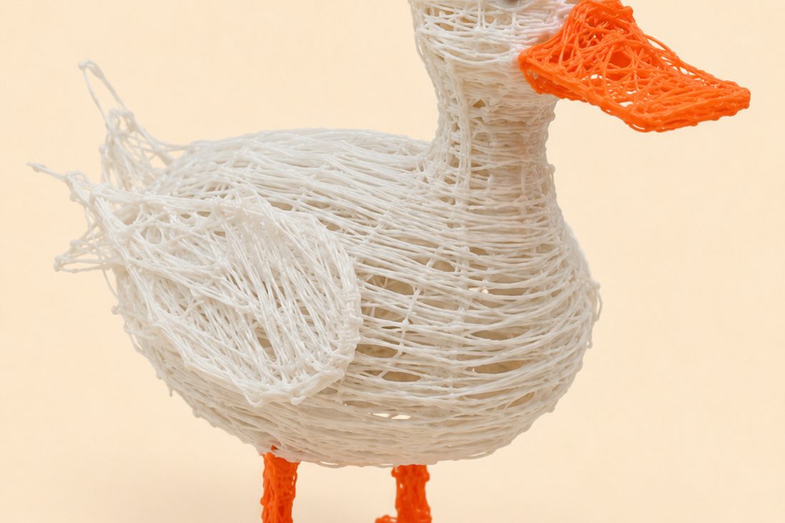 A white PCL duck with an orange beak, drawn with a low-temperature 3D pen